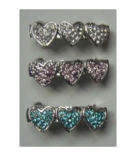 Barette avec 3 coeurs en strass rose